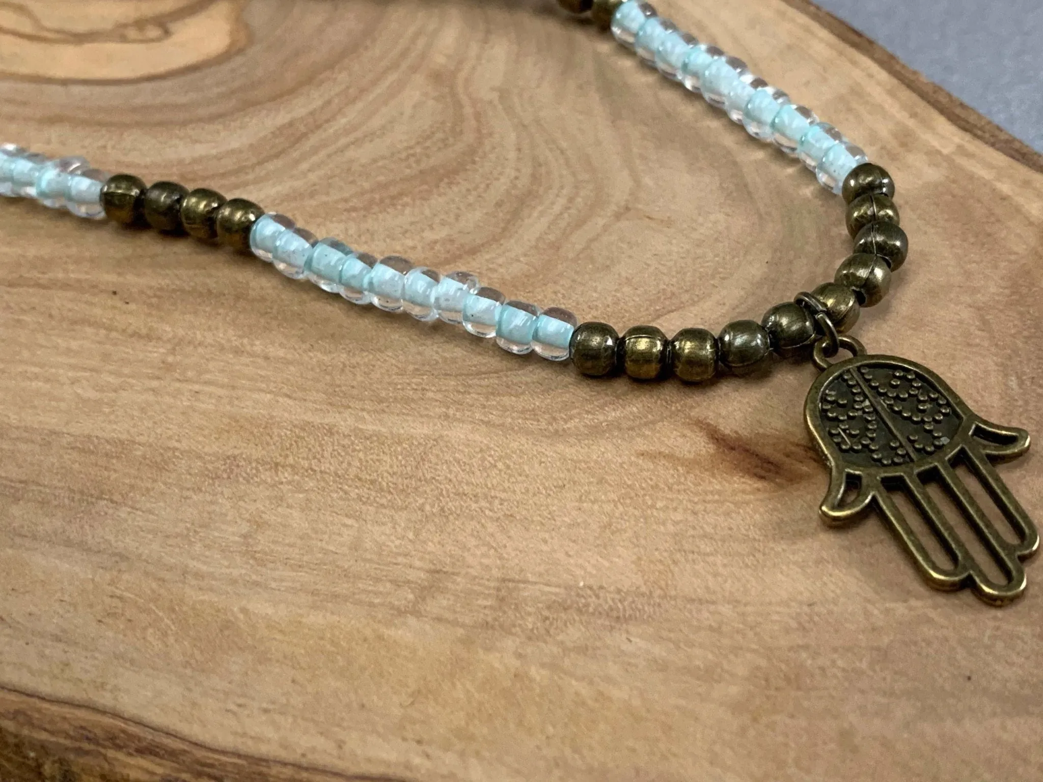 Dealla Handmade Beaded Necklace with Antique Bronze Hamsa